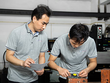 two worker checking dimension of 
